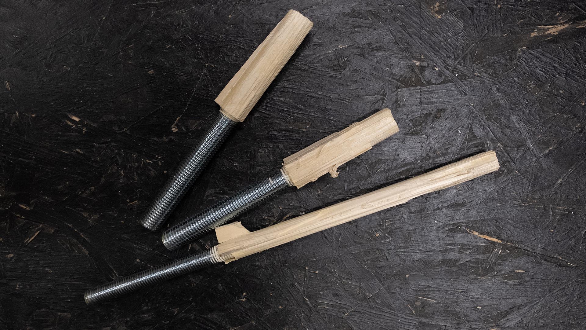 Several of the tensile-tested broken specimens