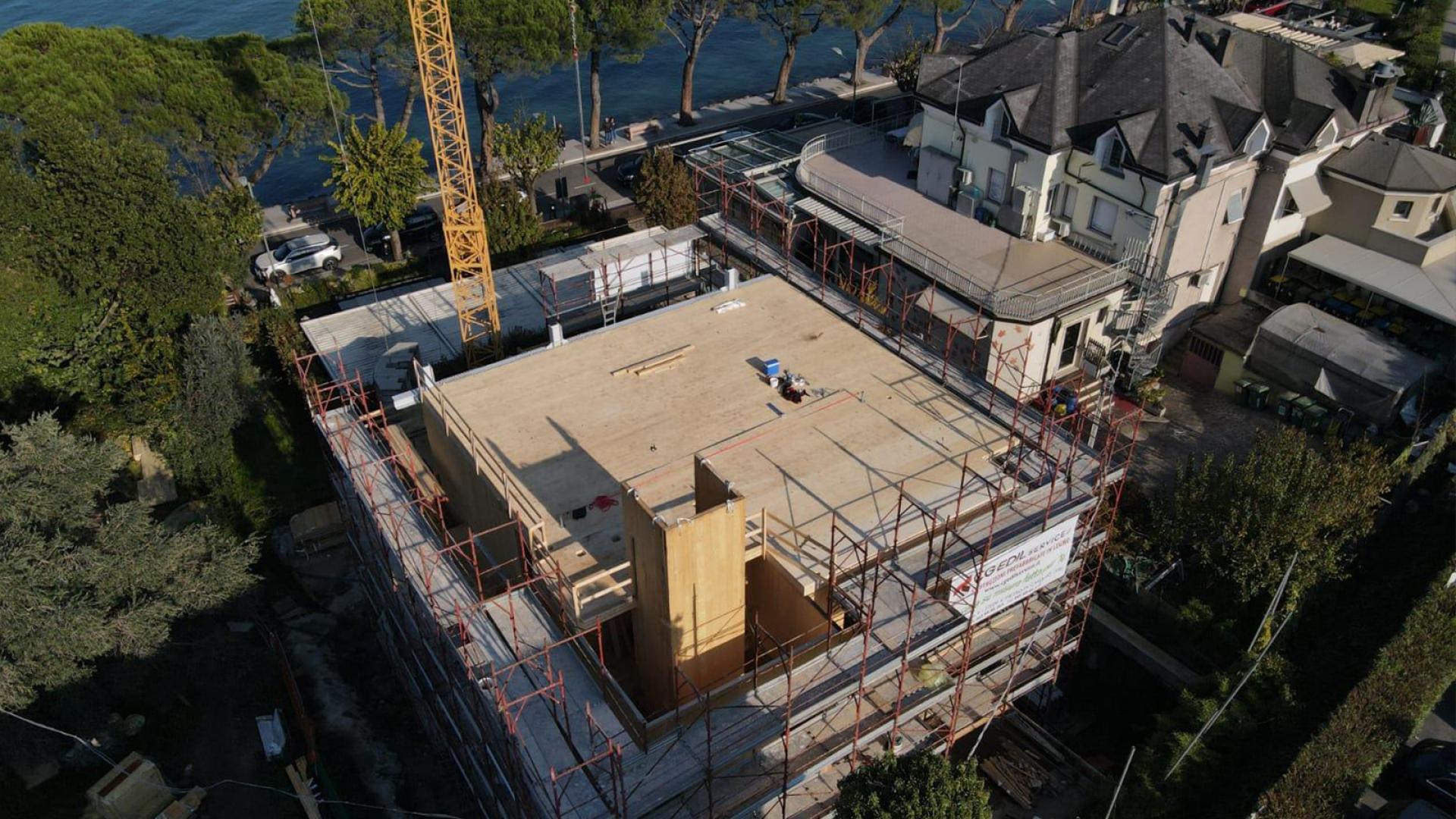 Overview of a multi-story building site with cross-laminated timber elements 