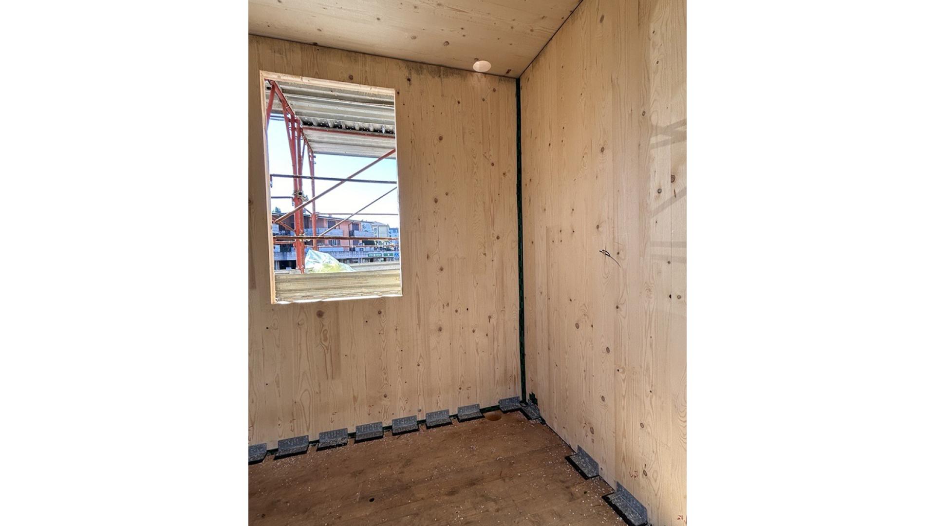 plates and soundproofing profiles between cross-laminated timber elements