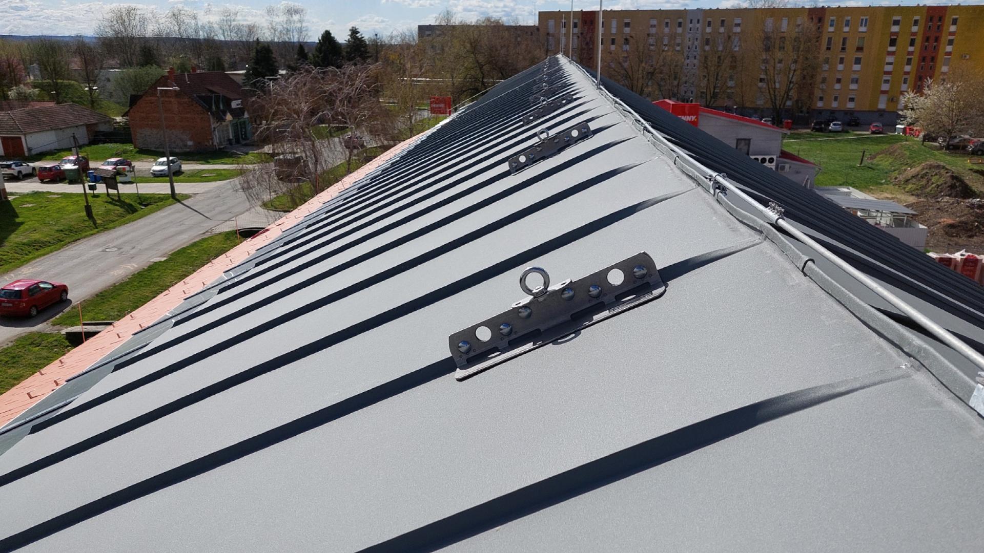 Standing seam metal roof with anchor point for safe access 