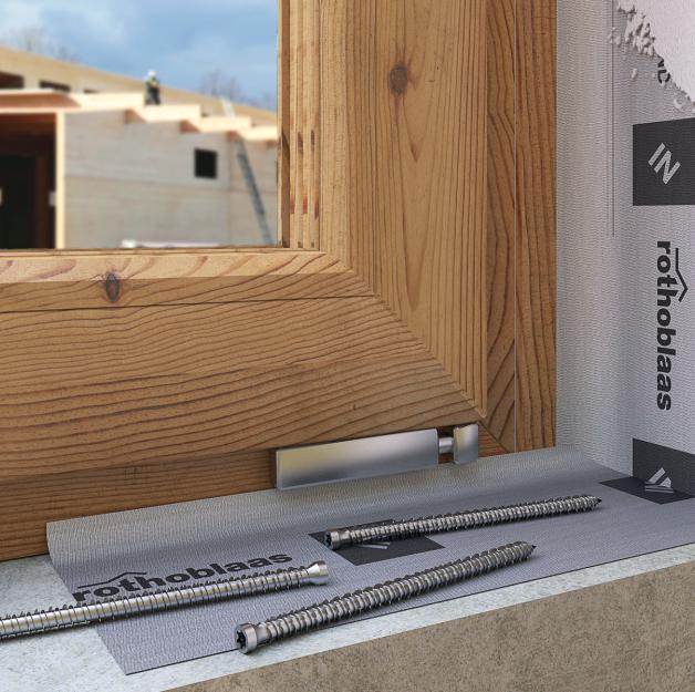 window frame installation with sealing tape and screws on construction site