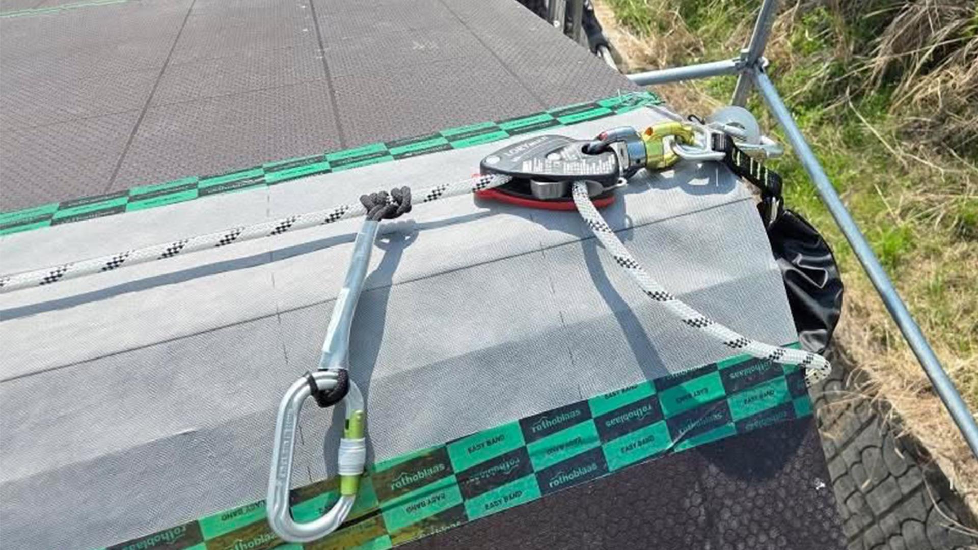 Workers installing HOLD-SYSTEM® on a sloped roof in South Korea