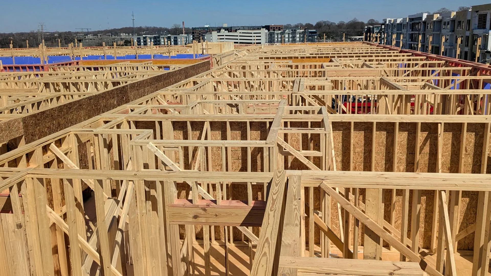 Timber frame in residential construction showing wall assembly with insulation layers 