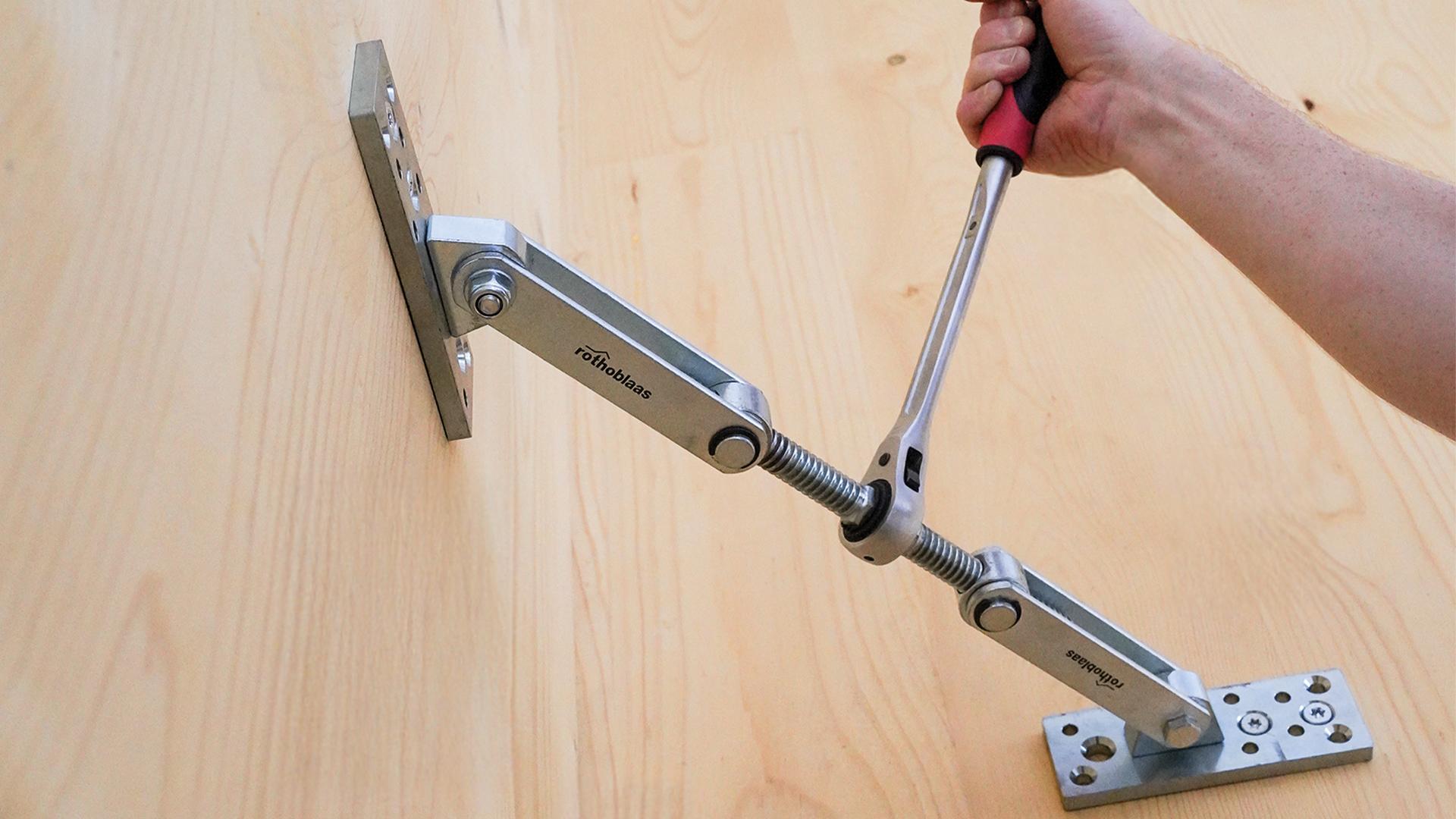GEKO panel puller used to join two mass timber elements at an edge joint during assembly