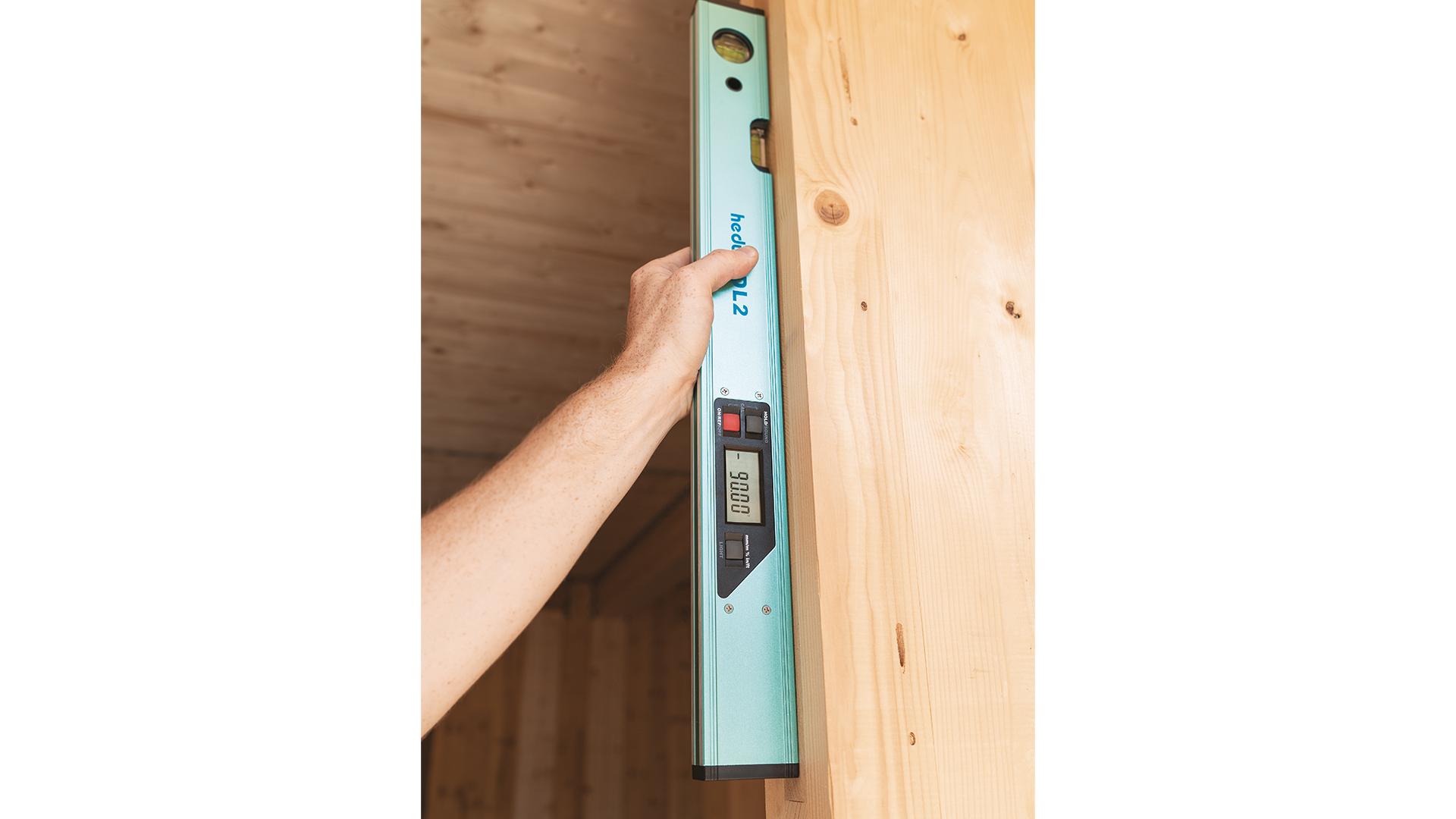 HERON spirit level on timber background 