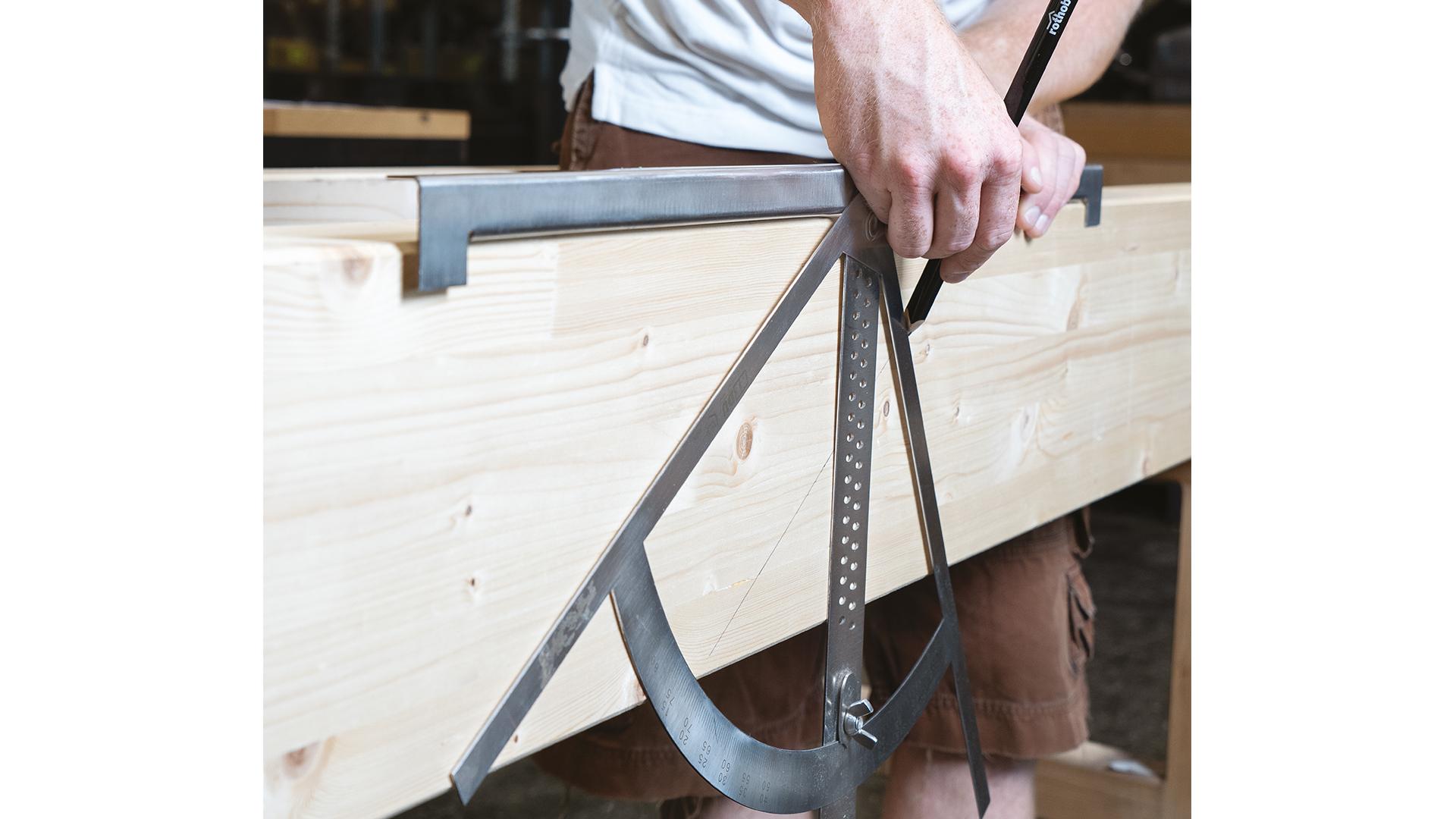 Carpenter’s square in use on timber surface 