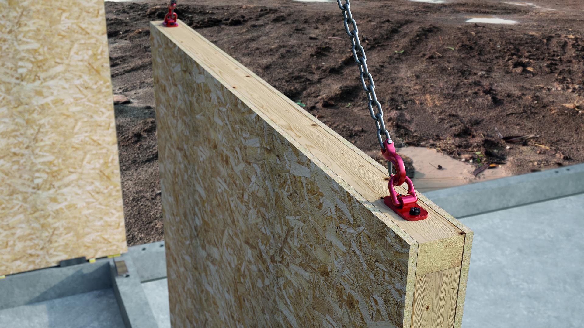RAPTOR MINI installed on a timber frame wall panel during lifting and transport on site