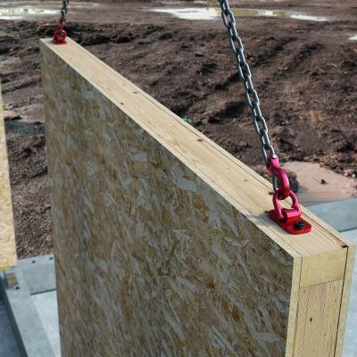 RAPTOR MINI installed on a timber frame wall panel during lifting and transport on site