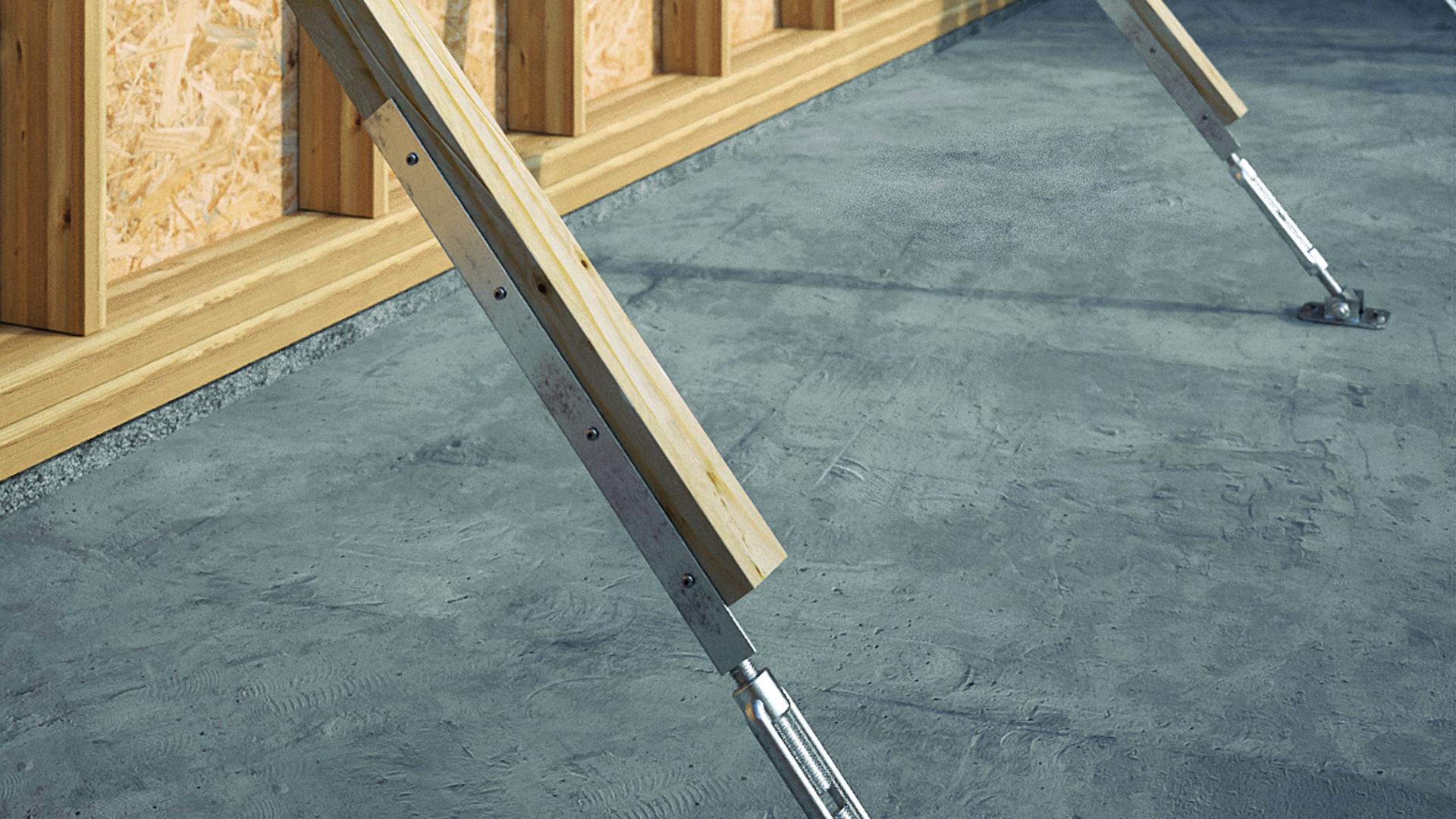 GIRAFFE LITE temporary support brace stabilizing a timber frame wall during installation)