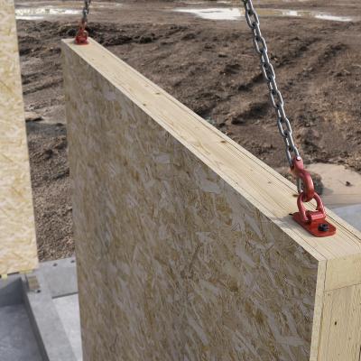 Lifting prefabricated timber wall panels on site using crane and mechanical lifting systems for wooden prefabricated buildings 