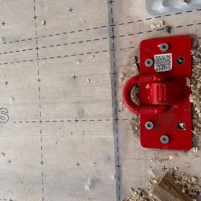 RAPTOR lifting plate installed on timber floor with DEFENCE ADHESIVE TRASPIR membrane during construction