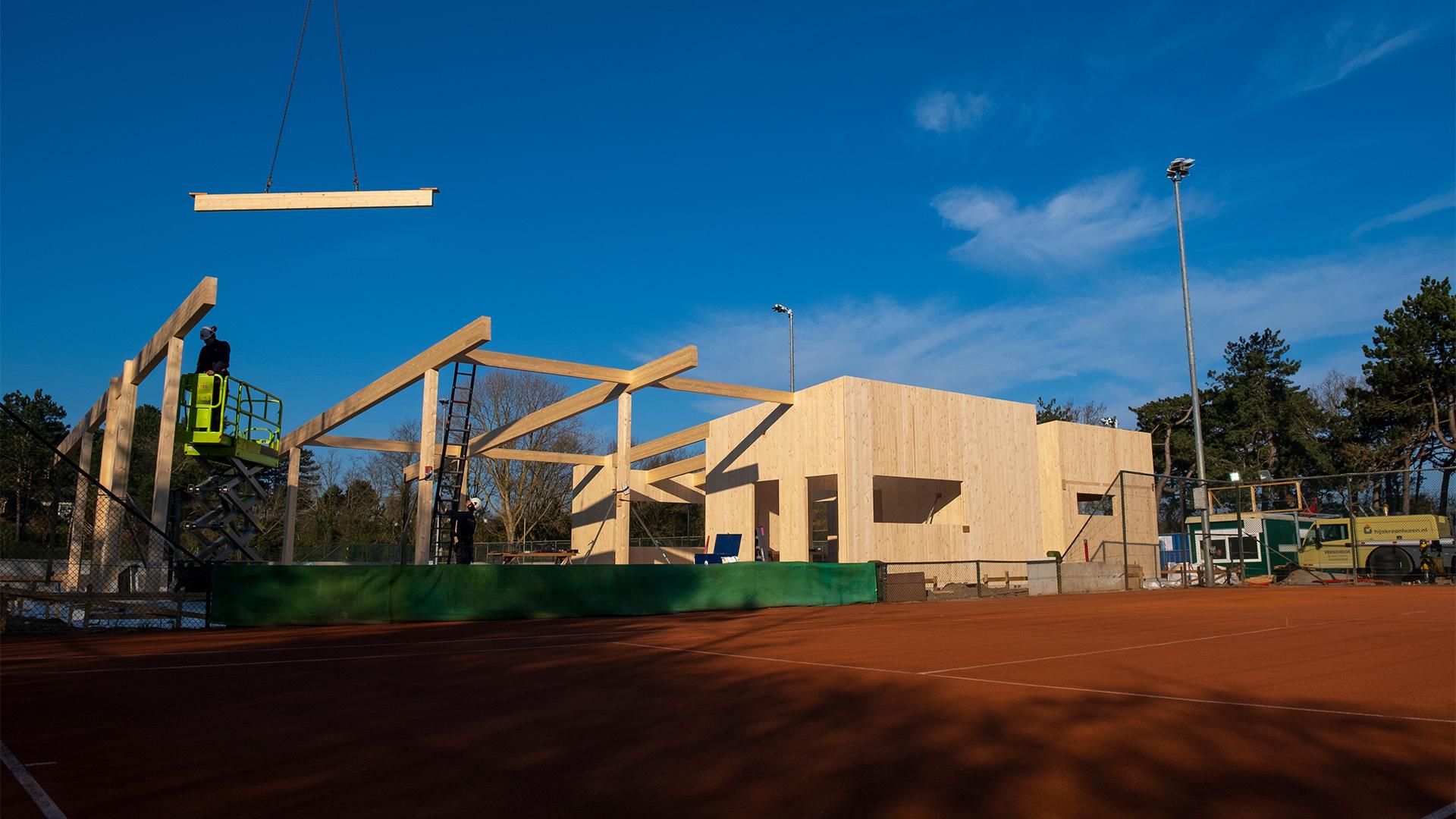 Timber pavilion construction with glulam beams and CLT structure at tennis club site 