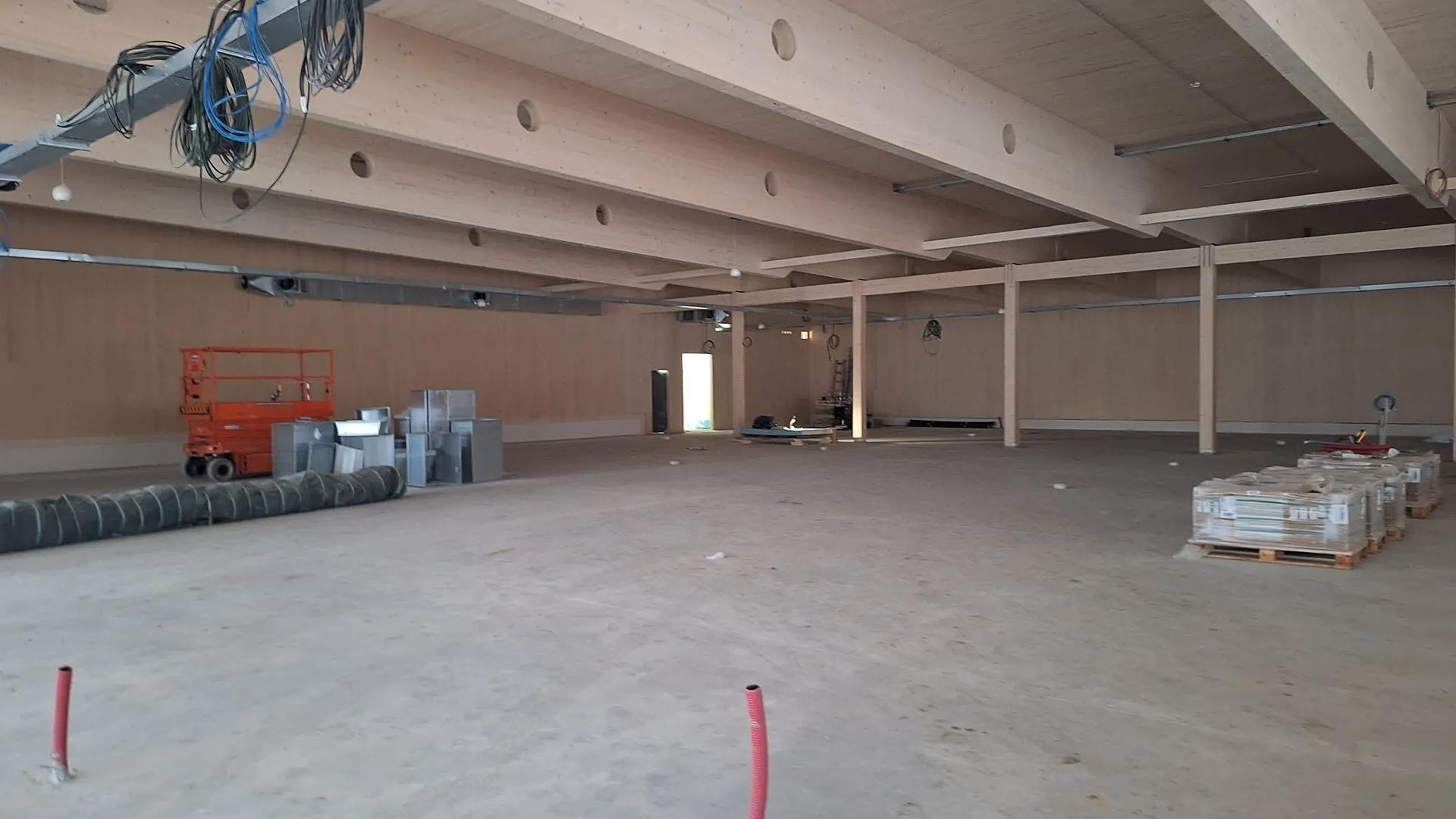Glulam roof beams for a timber supermarket interior