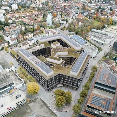 Aerial view of Biel campus with large-scale engineered timber building and post and beam structure integrated in urban context