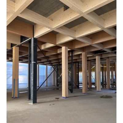 Post and beam engineered timber structure with glulam beams and columns connected to concrete slab in hybrid system 