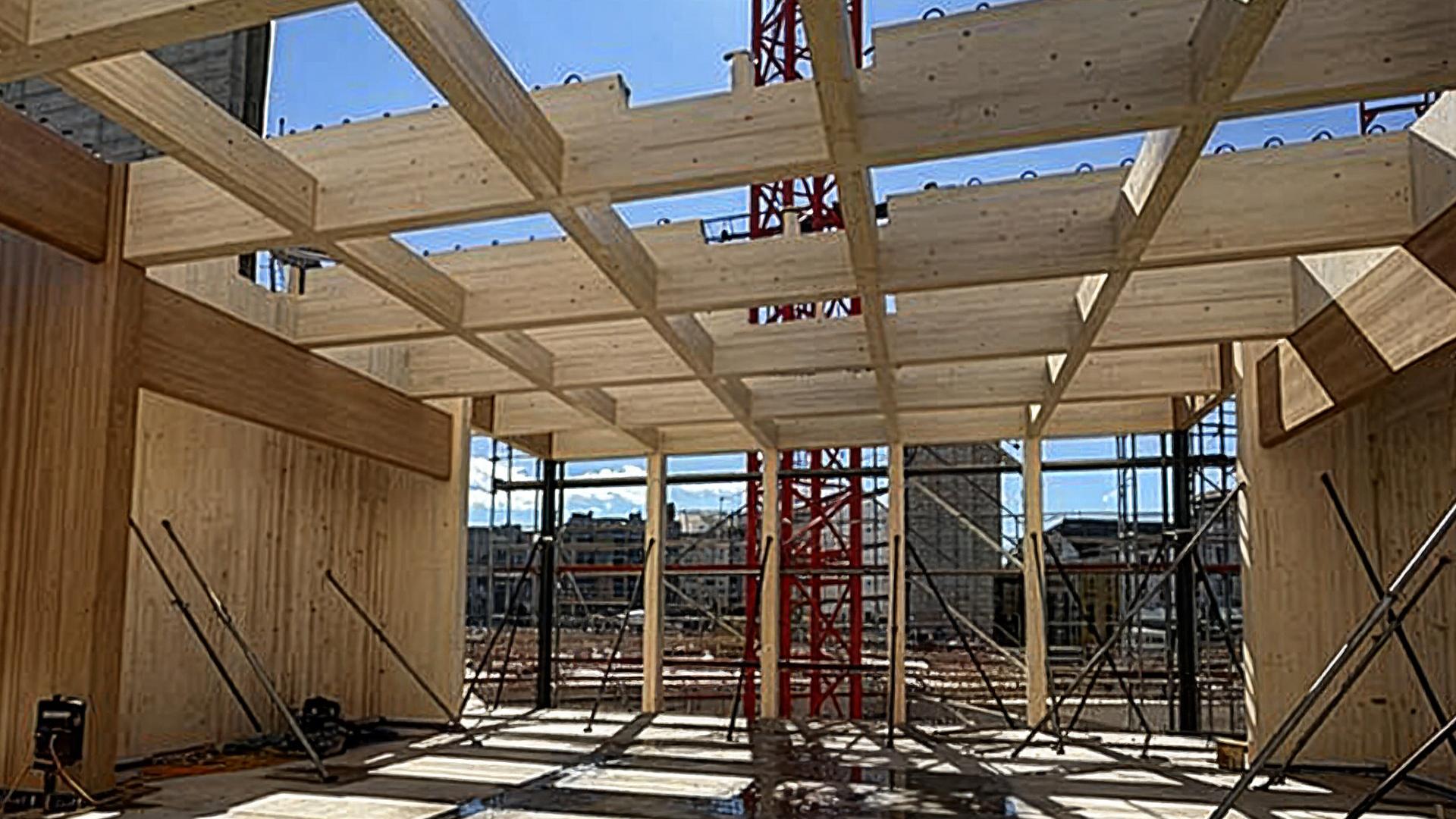 Post and beam engineered timber structure under construction with glulam beams and prefabricated system on construction site
