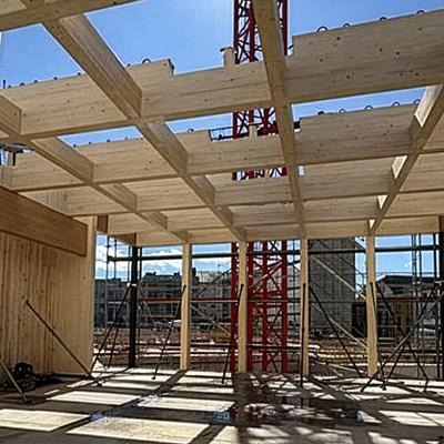 Post and beam engineered timber structure under construction with glulam beams and prefabricated system on construction site