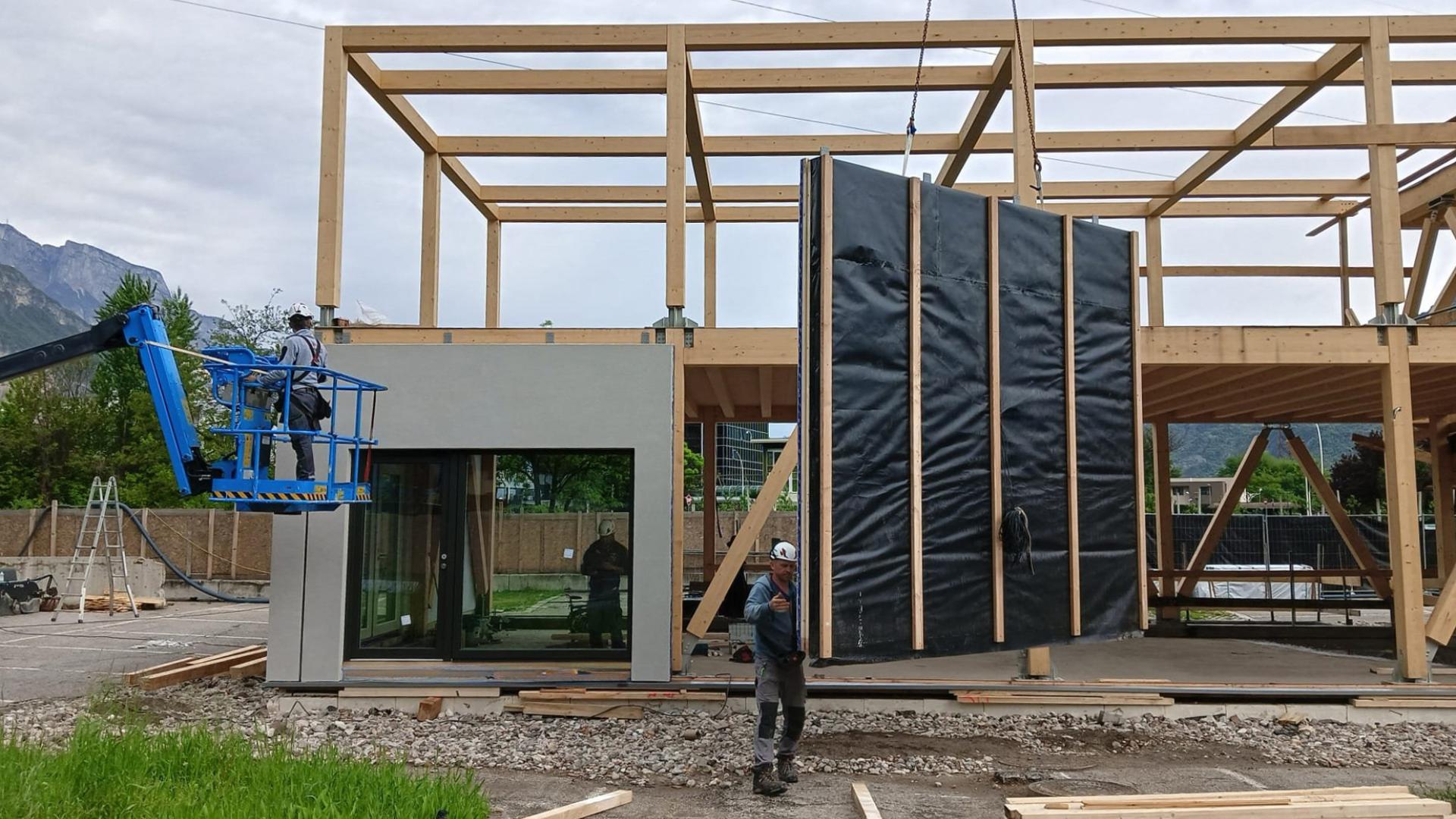 Prefabricated timber facade panel installation on site for off-site retrofit and building envelope upgrade