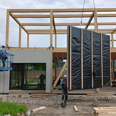 Prefabricated timber facade panel installation on site for off-site retrofit and building envelope upgrade