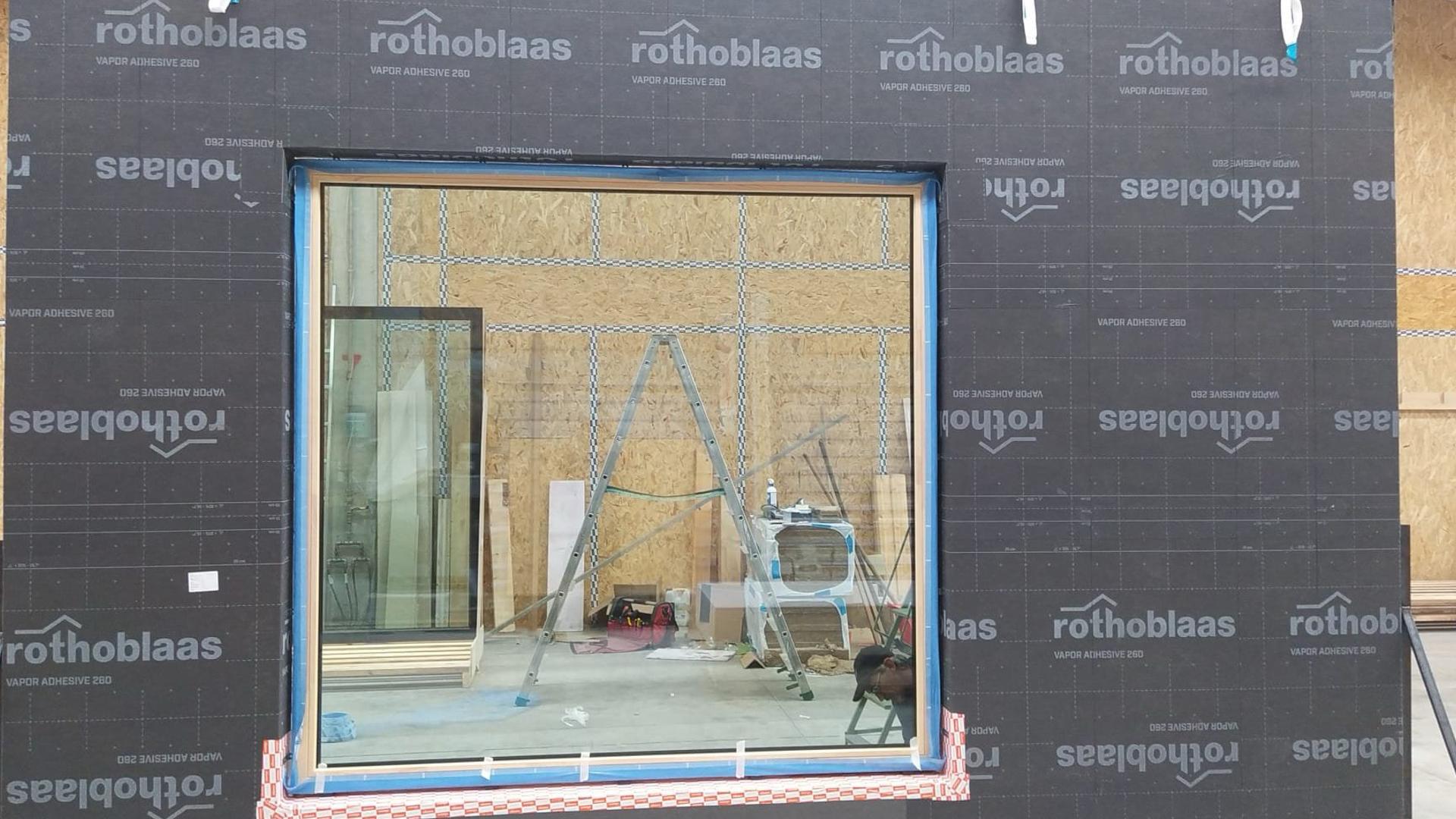 Prefabricated timber facade with Rothoblaas membrane installed in factory for airtight building envelope retrofit