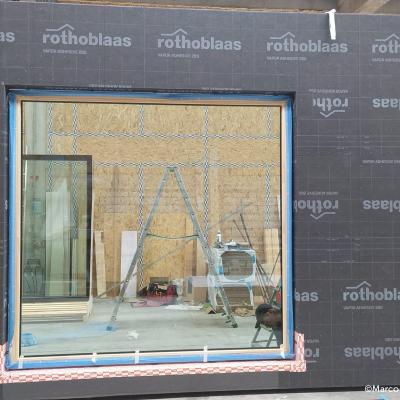 Prefabricated timber facade with Rothoblaas membrane installed in factory for airtight building envelope retrofit