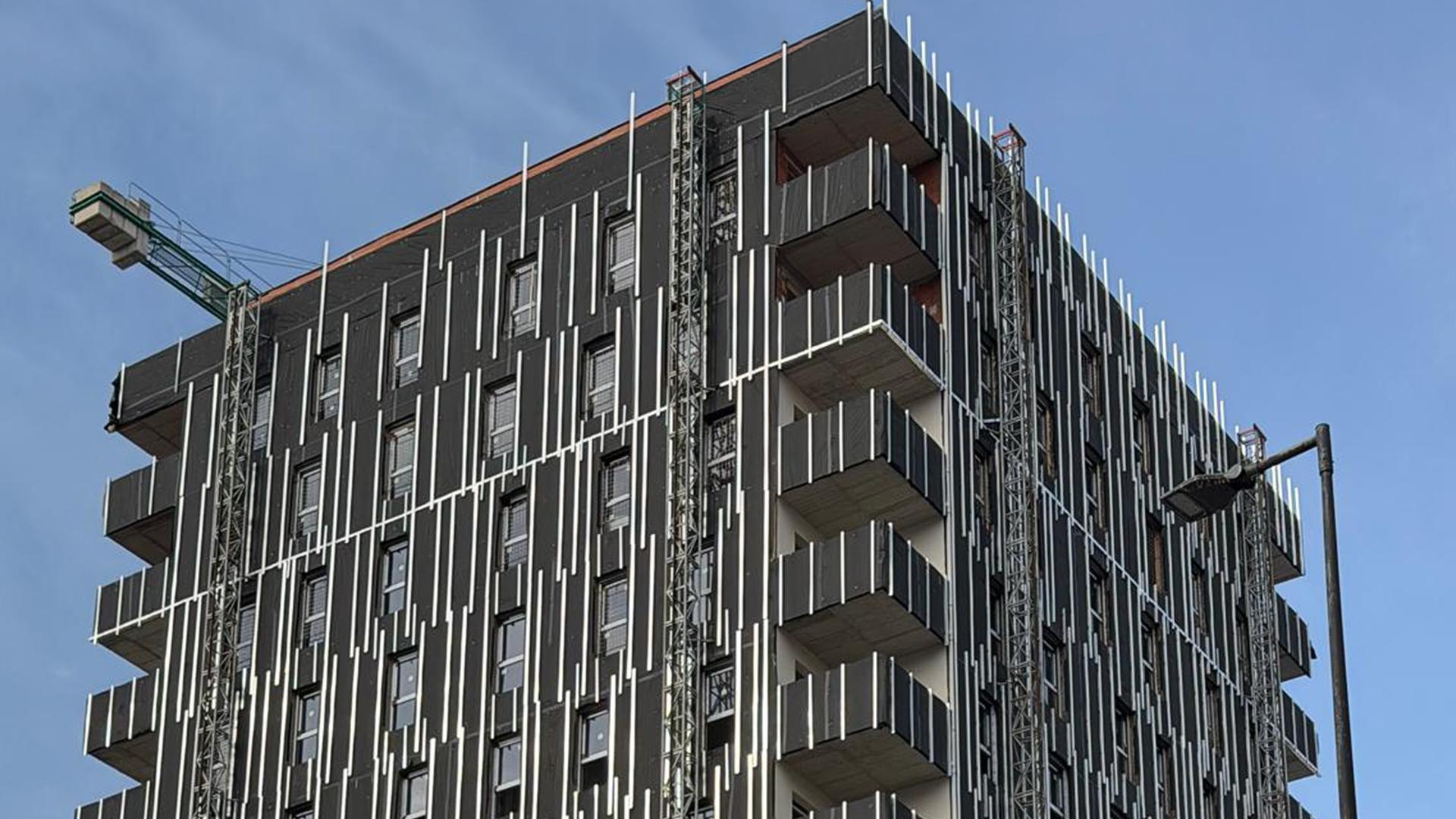 Completed ventilated façade protecting the building envelope of a multi-storey residential building